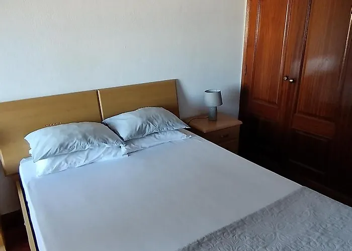 Проживание в семье Quarto Com Varanda No Centro Em *